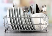 clean dishes drying on dish rack