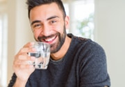 man drinking clean glass of water